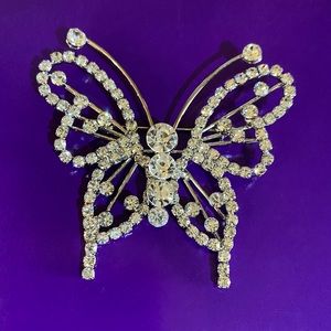 Butterfly brooch/pin with clear rhinestones.